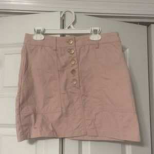 Forever 21; light pink mini tight skirt; buttons in front; pockets;soft material